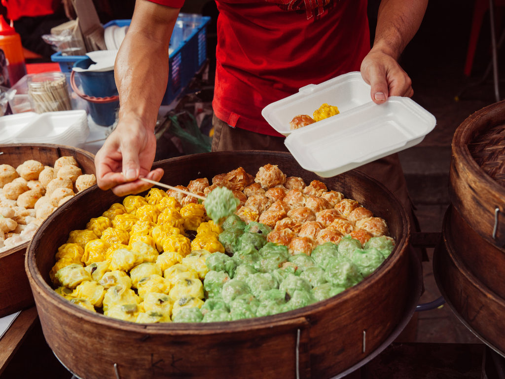 A street vendor selling colourful Dim sums 